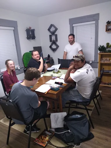 Players gathered around a game table